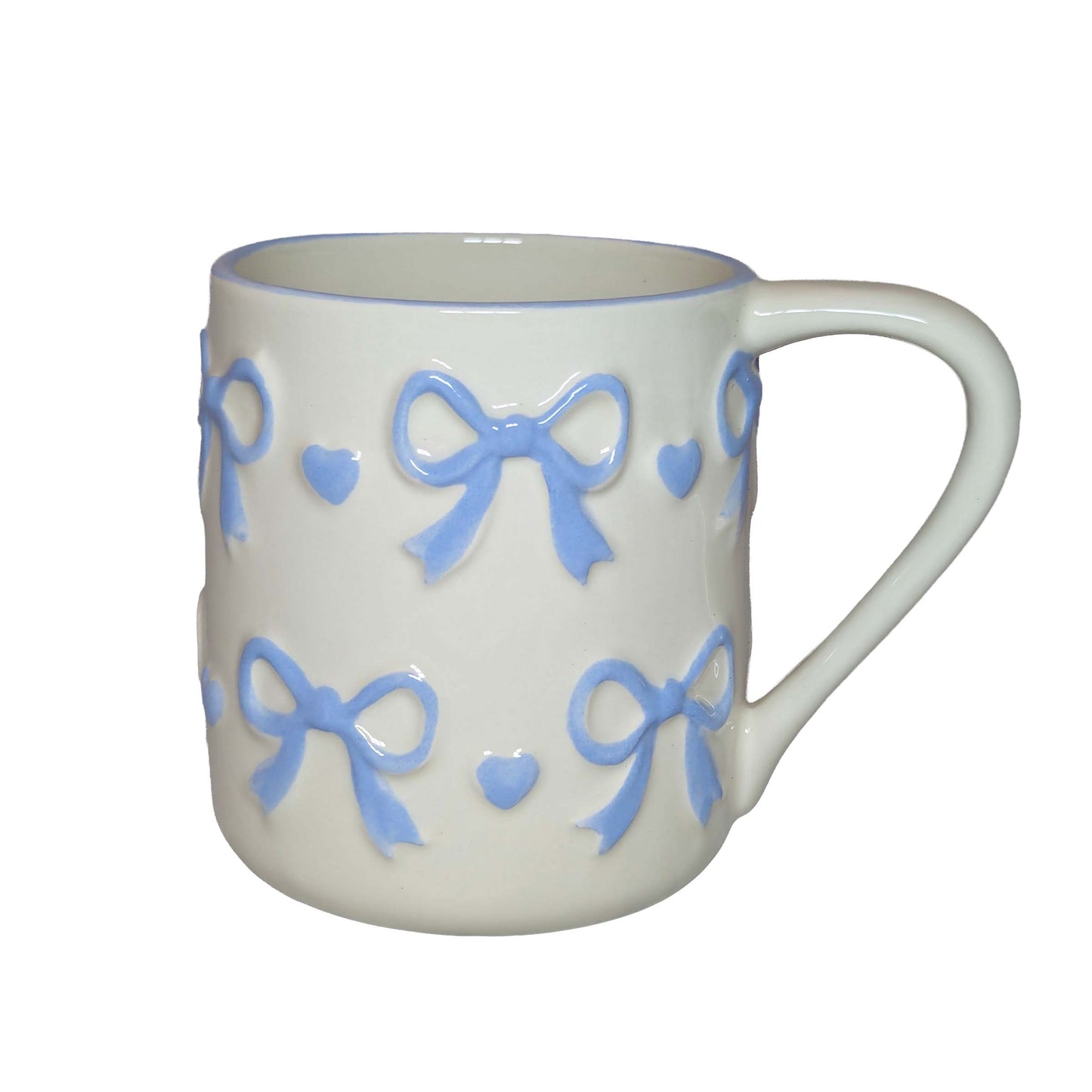 White ceramic mug with blue bow and heart patterns, perfect for themed Orlando resort gift baskets