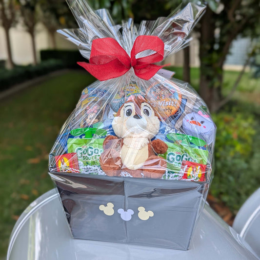 Custom Disney Chip gift basket filled with a licensed small plush toy, GoGo squeeZ apple sauce pouches, and sweet treats for Orlando resort delivery
