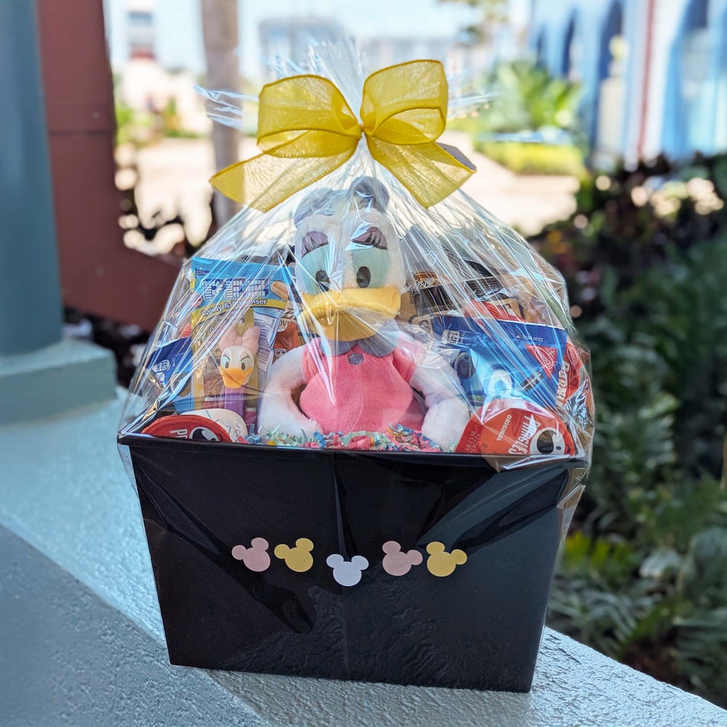 Disney Daisy Duck plush gift basket with snacks and treats, perfect for Walt Disney World resort deliveries in Orlando