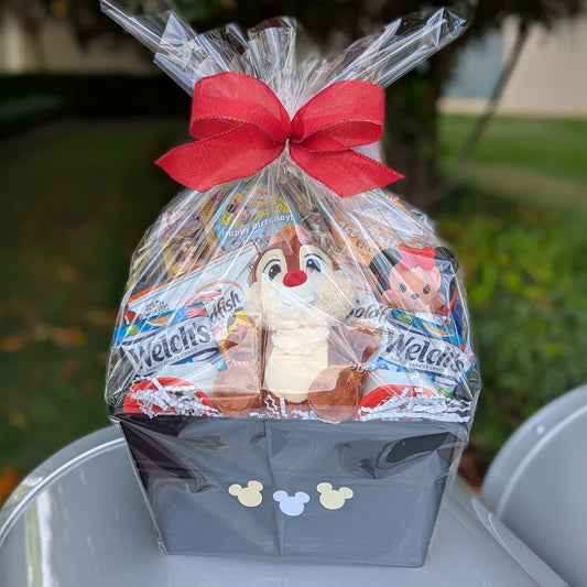 Custom Disney Dale gift basket filled with a licensed small plush toy, Welch's Fruit Snacks, and sweet treats for Orlando resort delivery
