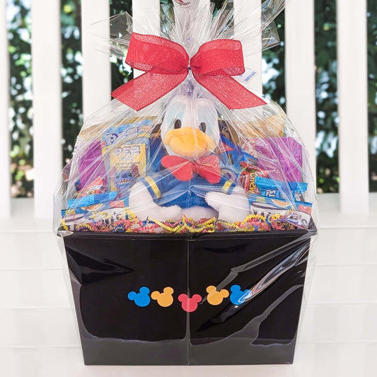Custom Disney Donald Duck gift basket filled with a licensed 8.25-inch mini bean bag plush toy, assorted snacks, and treats for Orlando resort delivery