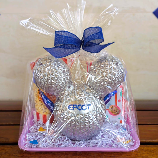 EPCOT Spaceship Earth light-up Mickey balloon refillable popcorn bucket gift basket wrapped in cellophane with a blue bow