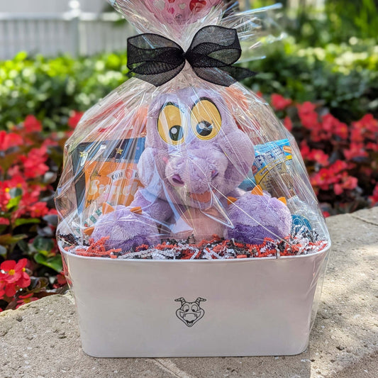 Disney Figment plush gift basket with snacks, treats, and a PEZ dispenser, perfect for Walt Disney World resort deliveries in Orlando