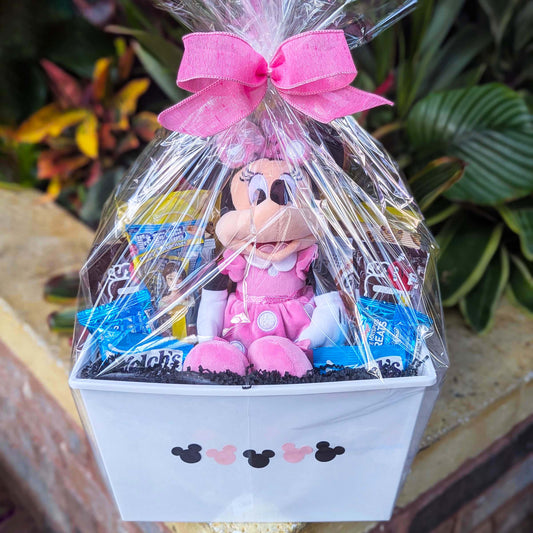Custom Disney Minnie Mouse gift basket filled with a licensed 14-inch pink plush toy and assorted snacks for Orlando resort delivery