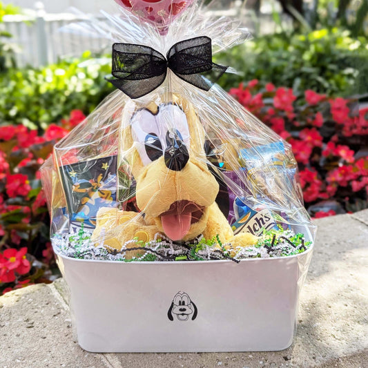 Custom Disney Pluto gift basket filled with a licensed plush toy, assorted snacks, and treats for Orlando resort delivery