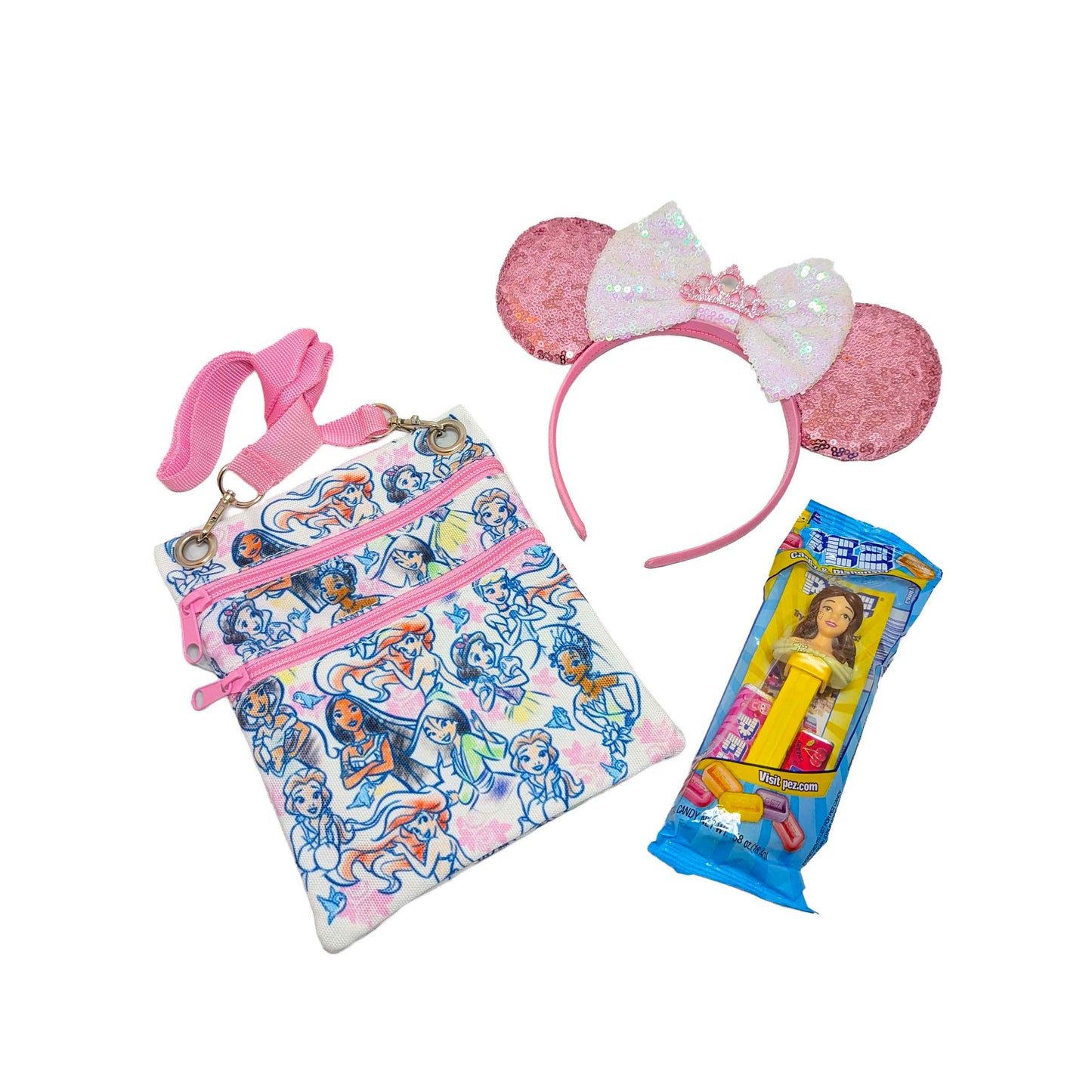 Disney Princess gift set featuring a themed passport crossbody bag, matching pink sequined Minnie ears with a tiara, and a princess PEZ dispenser for custom Orlando resort gift baskets