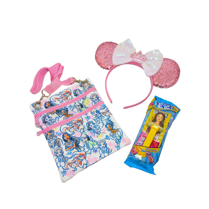 Disney Princess gift set featuring a themed passport crossbody bag, matching pink sequined Minnie ears with a tiara, and a princess PEZ dispenser for custom Orlando resort gift baskets