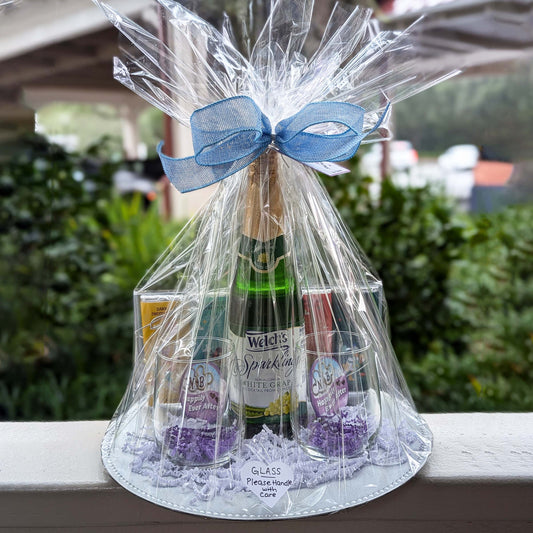 Custom Disney-themed Happily Ever After Toast gift basket featuring two stemless wine glasses, celebration buttons, and sparkling grape juice for Orlando resort delivery