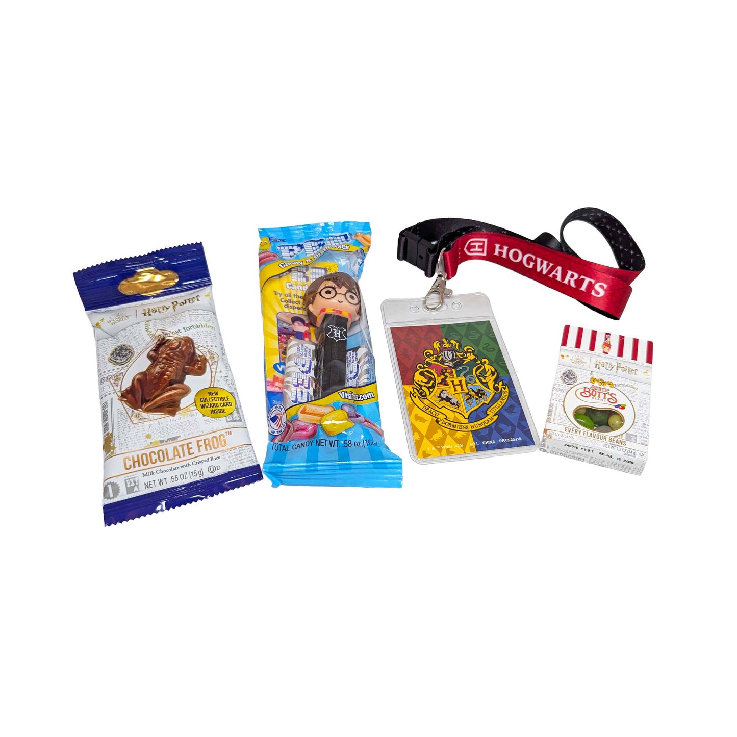 Flat lay arrangement of a Hogwarts themed lanyard, a Chocolate Frog, themed PEZ dispenser, and Bertie Bott's Every Flavor Beans for an Orlando resort gift box