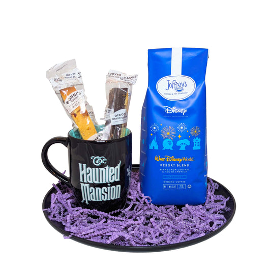 Haunted Mansion themed black coffee mug with biscotti and a blue bag of Joffrey's Resort Blend coffee for Disney vacation gifts