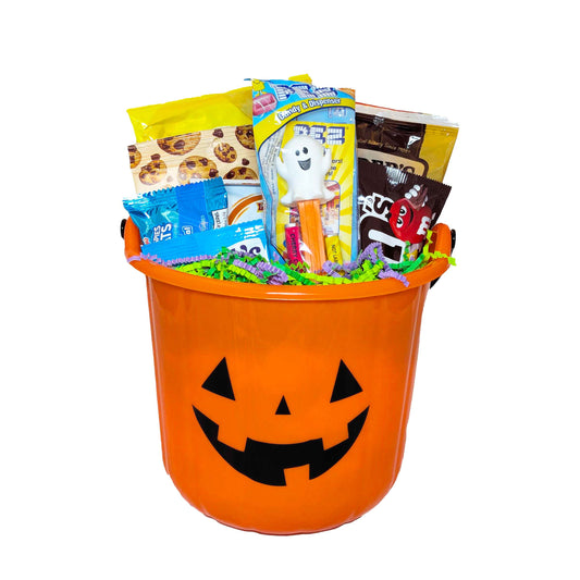 Mickey Mouse inspired Halloween pumpkin snack bucket filled with vacation treats for theme park resort delivery