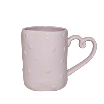 Pink ceramic mug featuring a distinctive heart-shaped handle, perfect for themed Orlando resort gift baskets