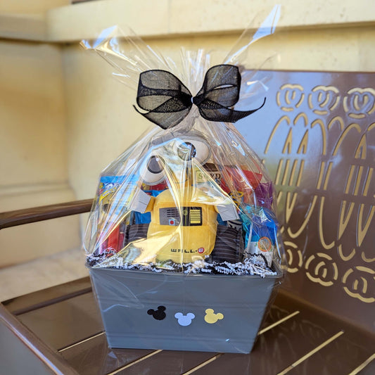 Custom WALL-E themed gift basket featuring a plush toy, assorted snacks, and treats for Orlando resort delivery